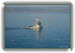 A boat * Brač island in the distance * 800 x 531 * (86KB)